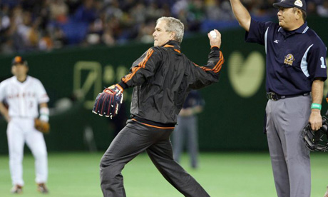 George Bush throws the ceremonial first pitch before game three of the Japan Series in Tokyo.