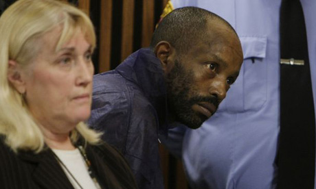 Anthony Sowell stands behind public defender Kathleen DeMetz during his court appearance in Cleveland, Ohio. Sowell faces murder charges after 10 bodies were found in his home.