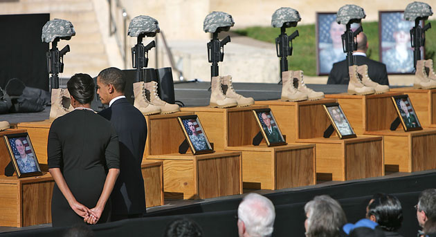 Obama visits Fort Hood: Barack and Michelle Obama pause in front of the picture of Sgt. Amy Krueger