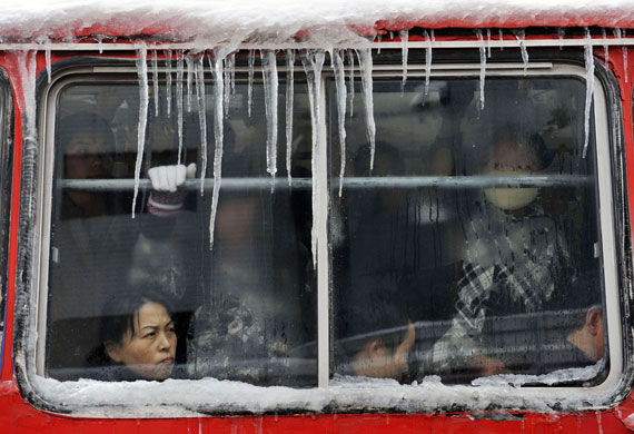 24 hours: Taiyuan, China: Ice forms on a public bus