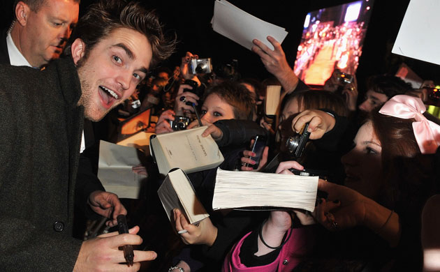 The Twilight Saga: New Moon London premiere: Robert Pattinson signs autographs for fans