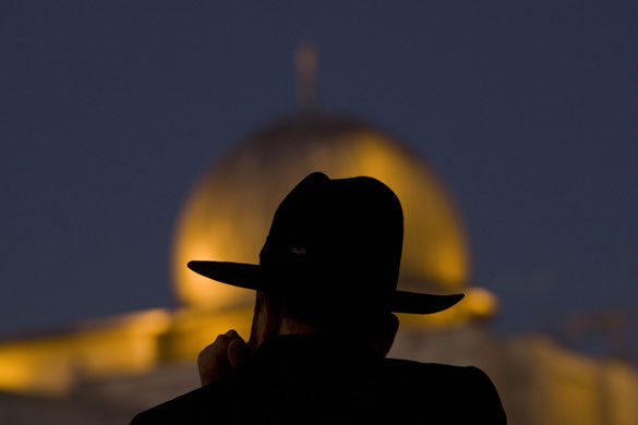 24 hours: Jerusalem: An ultra Orthodox Jewish man pauses in front the Al-Aqsa Mosque