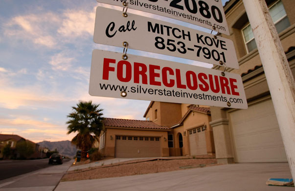 Homelessness: A sign hangs outside a foreclosed home in North Las Vegas