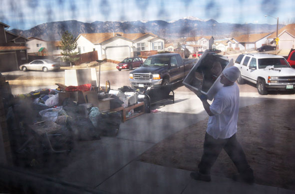 Homelessness: An eviction team removes furniture from a home that was being forclosed