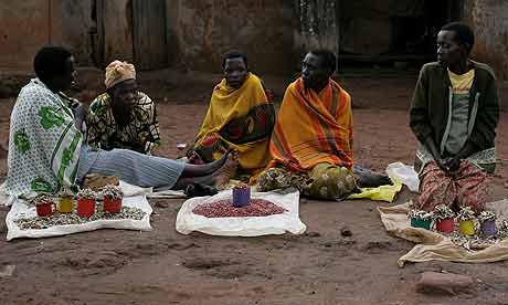 Women selling fish and groundnuts at Tiriri trading centre, Katine