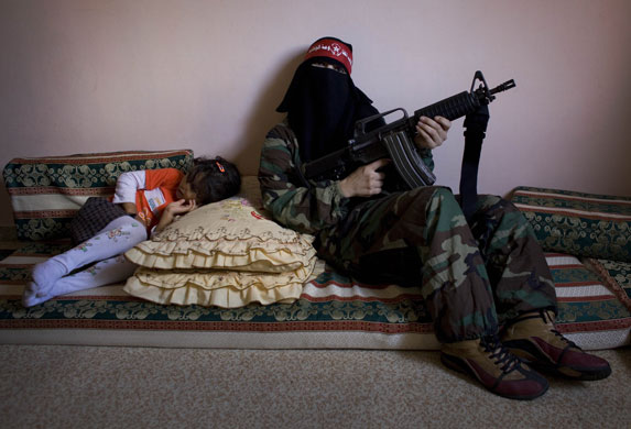 24 hours in pictures:  A woman militant in the Democratic Front for the Liberation of Palestine