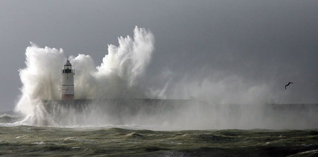 UK gales: Huge waves break over the lighthouse on Newhaven Harbour