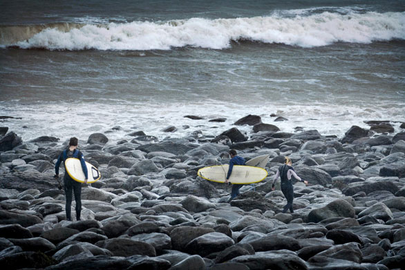 UK gales: Surfers head for the sea in wetsuits at Putsborough, North Devon