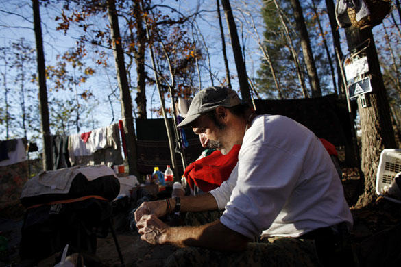 24 hours in pictures: homeless labourer lives in a park in Charlotte, North Carolina, USA