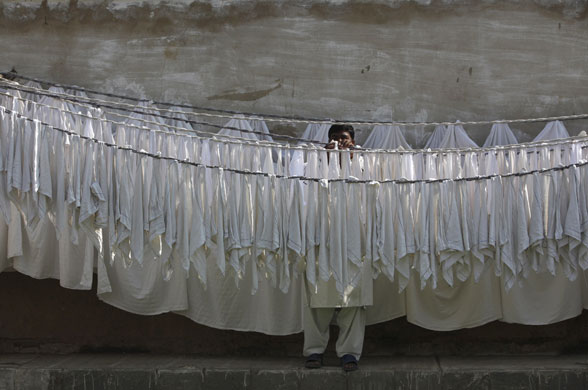 24 hours in pictures: Laundry man in Karachi