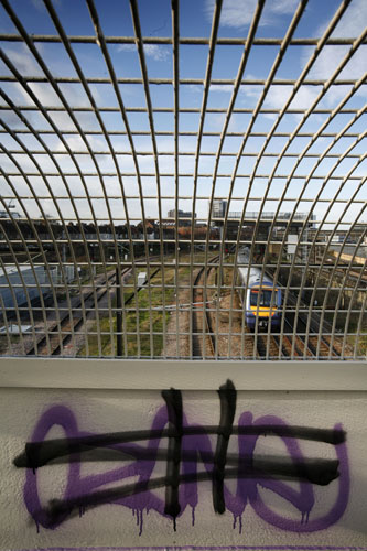 Train stations: Graffiti on a pedestrian bridge near Barking in east London 