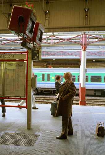 Train stations: A passenger scans a platform monitor at Crewe station