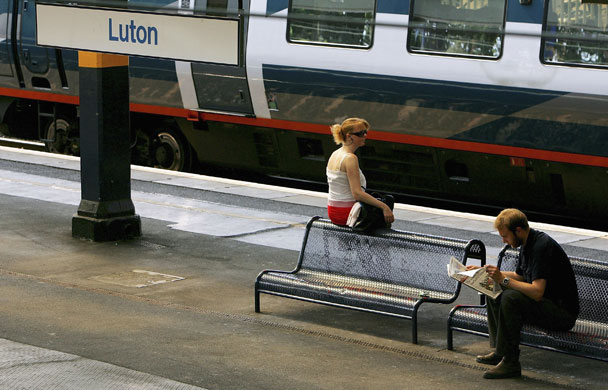 Train stations: Commuters wait for their train on the platform at Luton train station