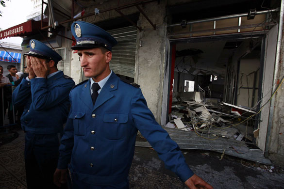 17 November 2009: Algiers, Algeria: Policemen stand guard at the damaged Djeezy office