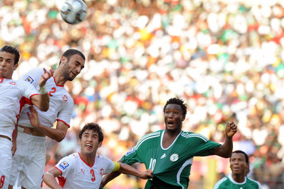 World Cup key players: Tunisian captain Kareem Haggui (3L) hold