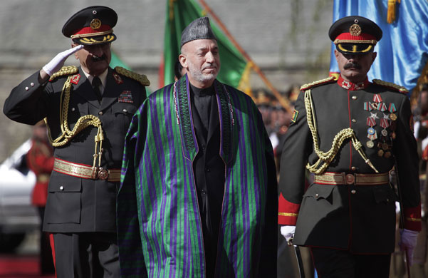 Hamid Karzai: President Hamid Karzai greets the guards of honour 