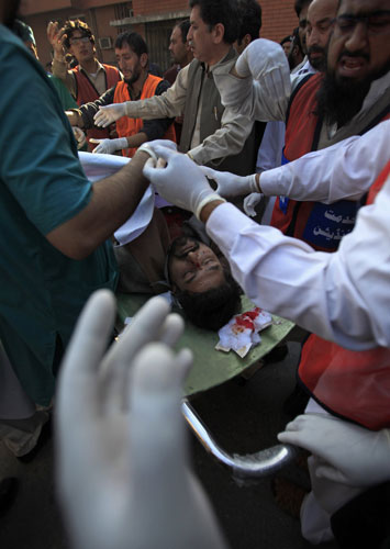 Pakistan bombing: Medics tend to a man who was injured