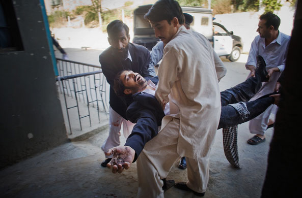 Pakistan bombing: A victim is rushed in for emergency treatment at the Lady Reading Hospital
