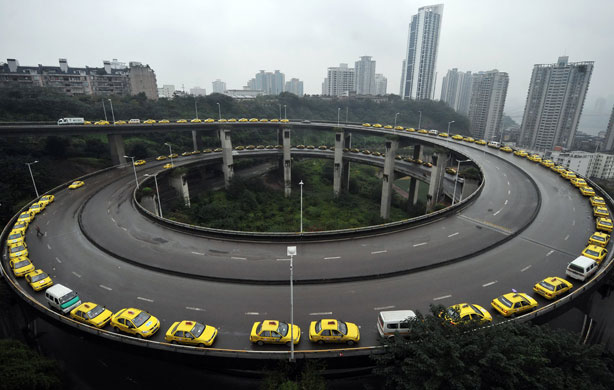 24 hours in pictures: Chongqing, China: Taxis queue up for liquid gas