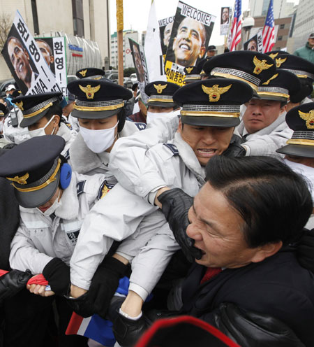 24 hours in pictures: Policemen scuffle with Korean activists in Seoul