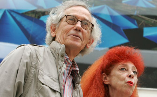 Christo and Jeanne-Claude stand in front of their piece titled The Umbrellas as they visit an exhibition of their work at Centre PasquArt in Biel, Switzerland in 2004