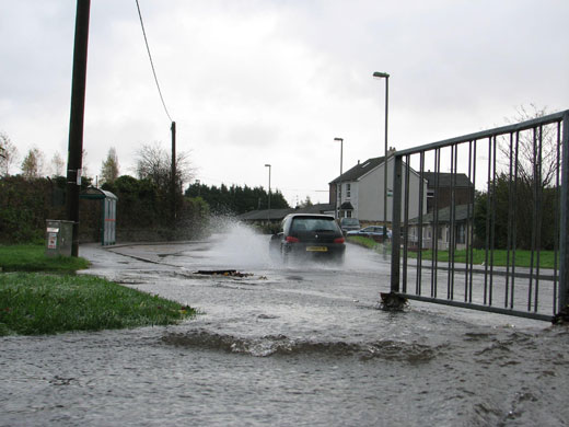 wet weather uk: Caerphilly: A flooded pavement in the Energlyn area 