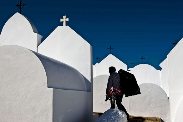 24 hours in pictures: A man walks among tombstones at the Casabermeja cemetery in Malaga