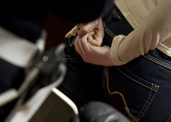24 hours in pictures : Amanda Knox is led from court after a session in Perugia