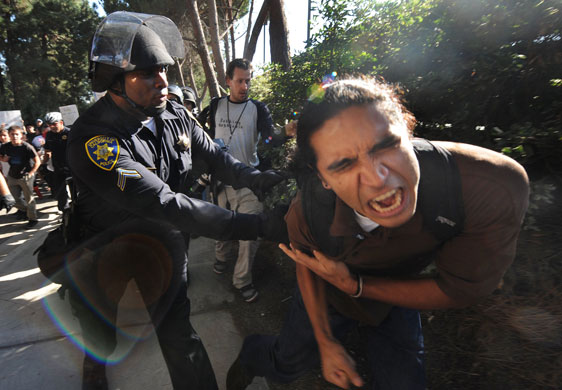 24 hours in pictures : A student protester is tazered by a police at UCLA