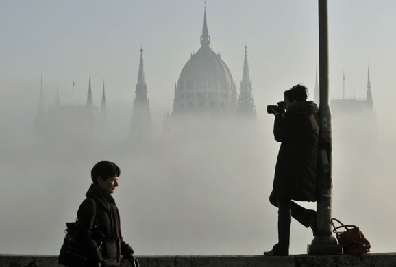 24 hours in pictures : Budapest, Hungary: Thick fog covers the Hungarian Parliament building