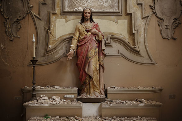 L'Aquila - 7 months later: Rubble on a statue in the Church of Santa Giusta, dating back to 1257