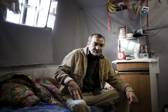 L'Aquila - 7 months later: Joseph from Romania lives in Piazza d'Armi in a tent in a temporary camp