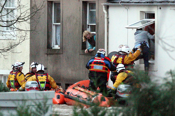 Weather flooding: Residents of the village of Cockermouth are rescued from their homes