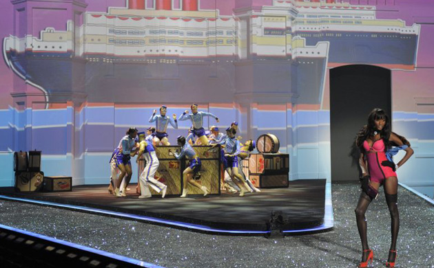 Sessilee Lopez poses in pink lingerie and red heels during the naval themed portion of the show