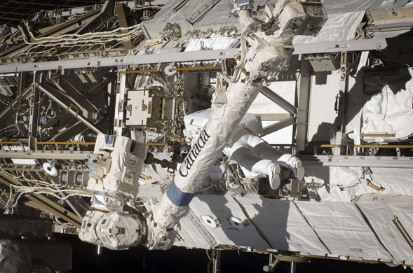 Space: Astronaut Robert L Satcher Jr works outside the International Space Station