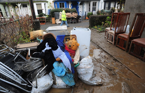 Cockermouth clear-up: Debris and flood damaged items outside homes in Cockermouth