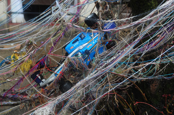 Cockermouth clear-up: A child's toy racing car is tangled with wool and other debris