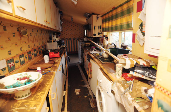 Cockermouth clear-up: The scene in Yvonne and Steve Lambert's kitchen after flood waters receded