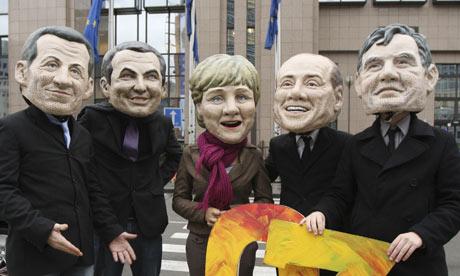 Climate protesters wearing masks of European leaders in Brussels on Monday