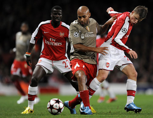 British Teams: Liege's Wilfred Dalmat, Emmanuel Eboue, left, and Andrey Arshavin 