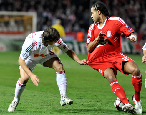 champions league: Glen Johnson is pulled back by  Zsolt Laczko