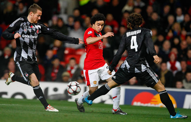 Wed Champions League: Manchester United's Rafael is challenged by Besiktas' Fink and Kas