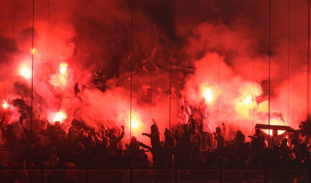 Wed champs 2: Marseille's supporters fire flares before the match against AC Milan