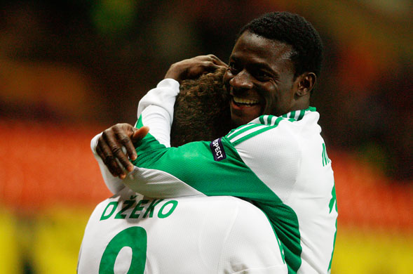 Wed champs 2: Edin Dzeko, left, is hugged by team-mate Obafemi Martins
