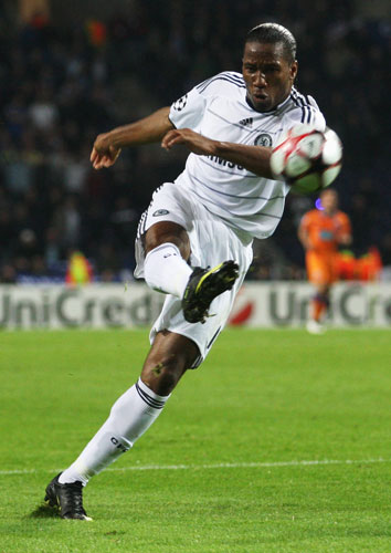 wed 3 champions: Didier Drogba tries a shot from just inside the area 