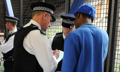 Metropolitan police officers on a stop and search operation in south London