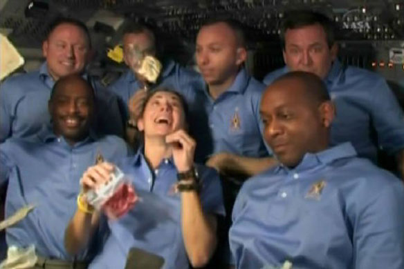 Thanksgiving Day Parade: The crew aboard the Space Shuttle Atlantis celebrate Thanskgiving Day