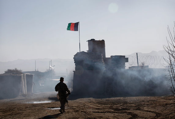 27 November 2009: Yousef Khel, Afghanistan: A US soldier walks across an Afghan National Army