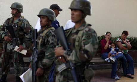 Soldiers stand guard outside the Honduras congress