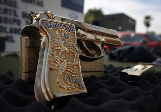 24 Hours in Pictures: Golden Gun Confiscated In Tijuana